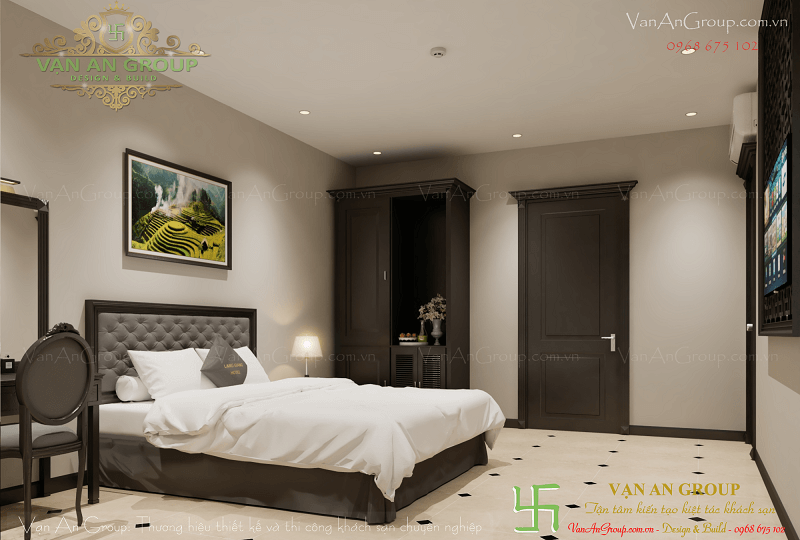 Tại phòng ngủ khách sạn 2 sao được trang bị tivi, tủ, bàn ghế